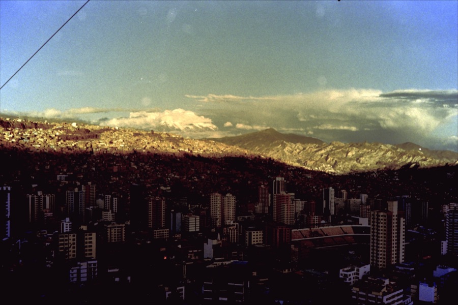 The bowl of La Paz seen from the rim, towers in shadow and the far slope lit gold